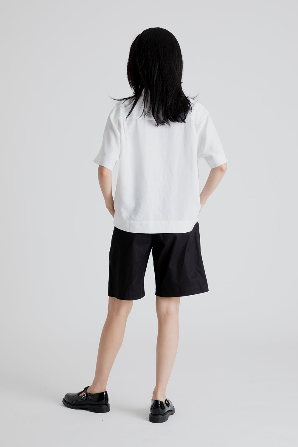 Uniform Bridge Women's One Tuck Half Chino Pants in Black