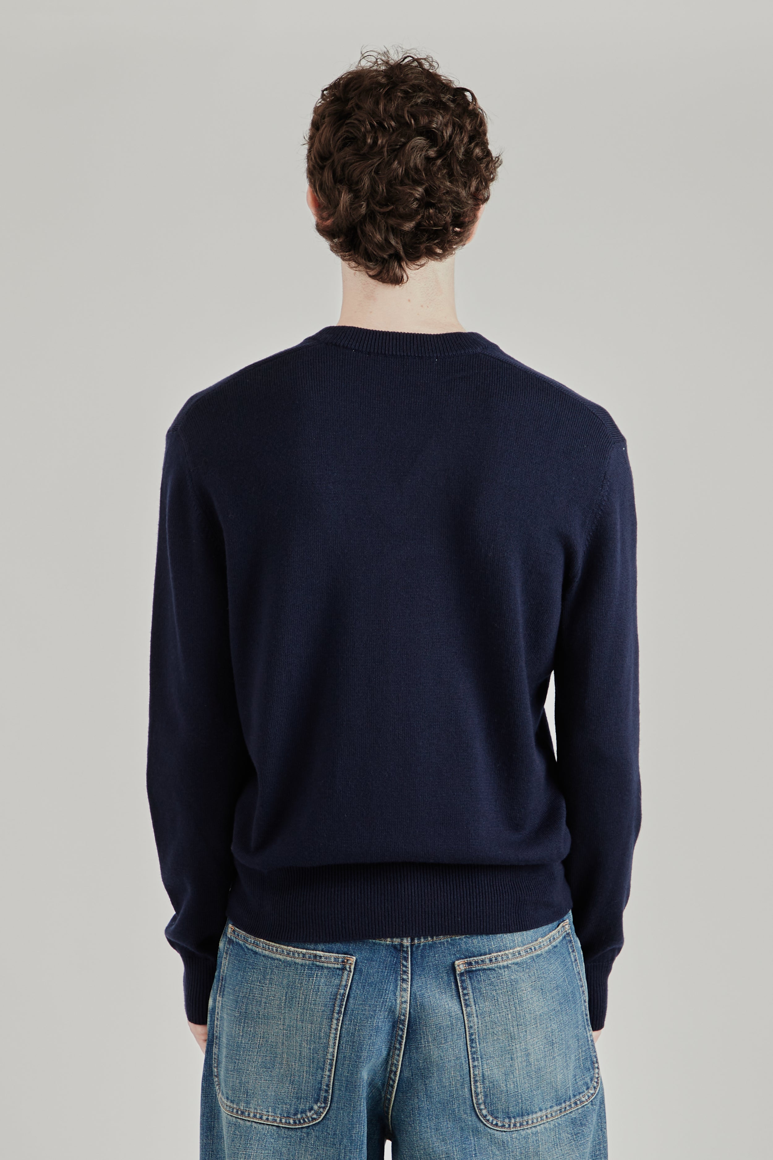 Shop the Sunflower Moon Merino V Neck Sweater for FW26. Available
